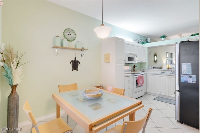 tiled dining area featuring sink