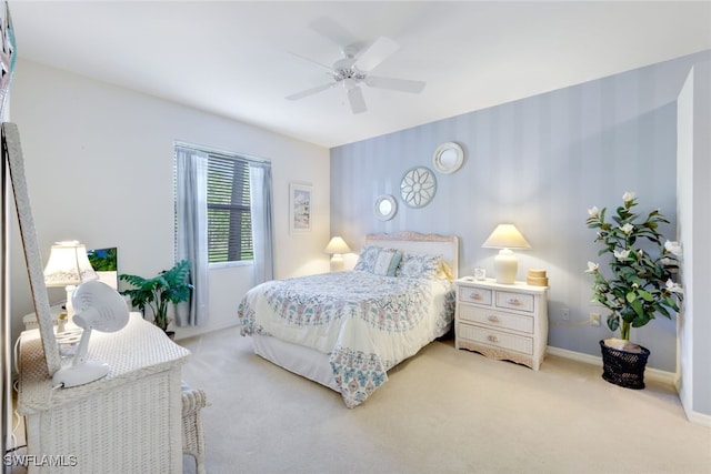 bedroom featuring light carpet and ceiling fan