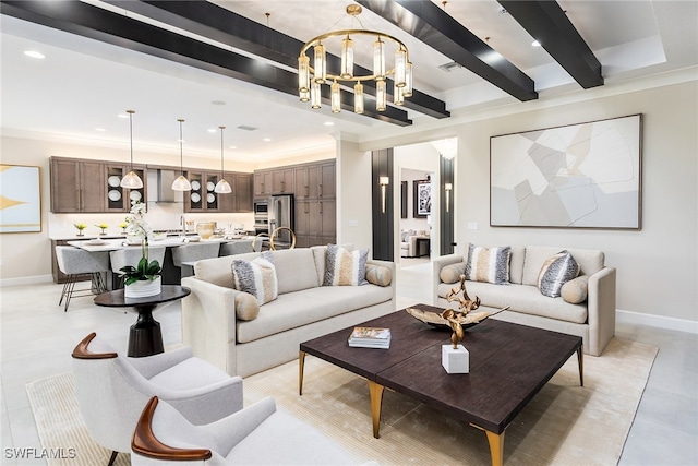 living room featuring beamed ceiling, ornamental molding, and a notable chandelier