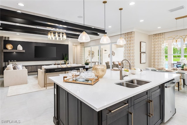 kitchen featuring dishwasher, a center island with sink, sink, hanging light fixtures, and light tile patterned flooring