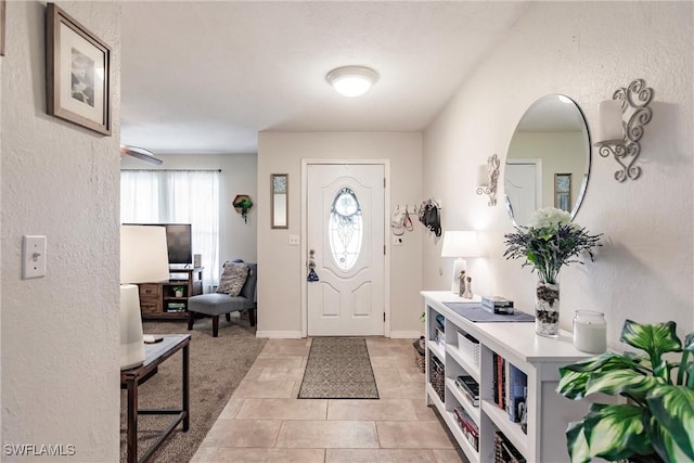 foyer featuring light tile patterned flooring