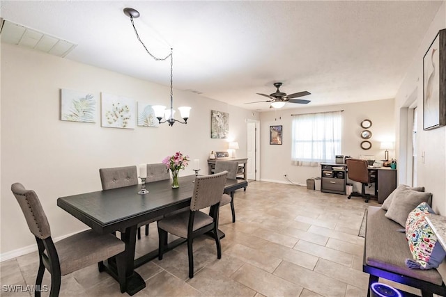 dining area with ceiling fan with notable chandelier