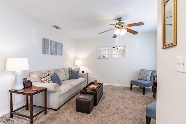 carpeted living room featuring ceiling fan