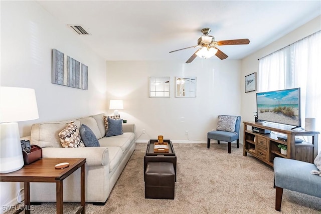 living room with ceiling fan and light carpet