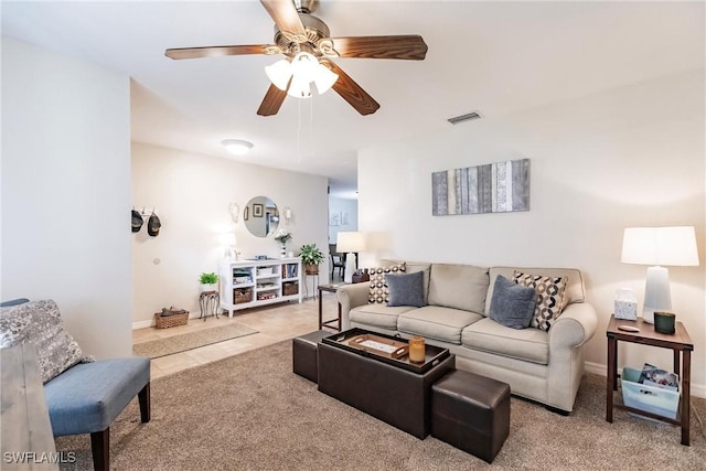 carpeted living room featuring ceiling fan