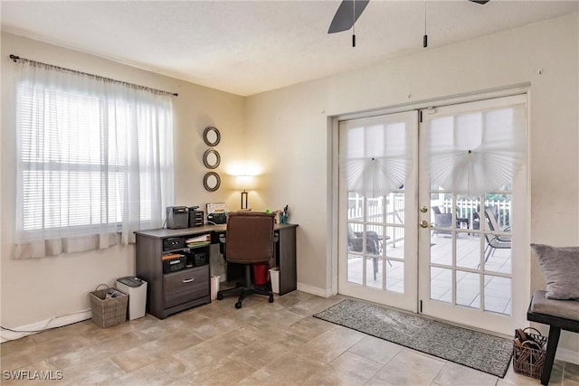 office with ceiling fan and french doors