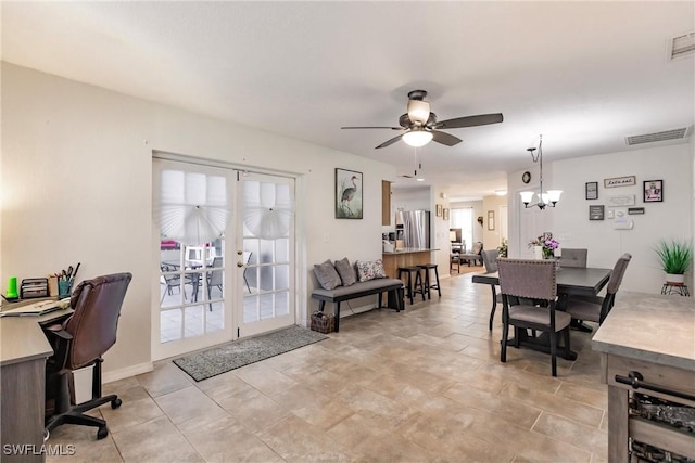 dining room with ceiling fan with notable chandelier and french doors