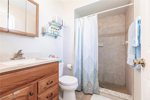 bathroom with tile patterned floors, curtained shower, vanity, and toilet