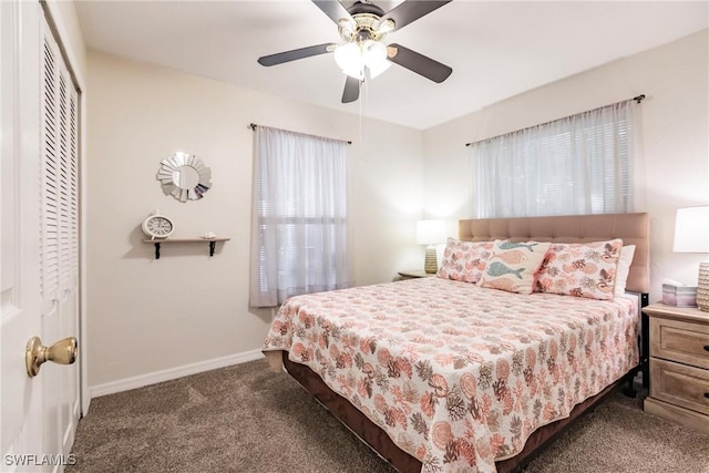 bedroom with carpet, ceiling fan, and a closet