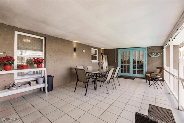 sunroom featuring french doors