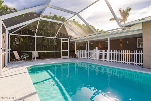 view of pool featuring a patio area and a lanai