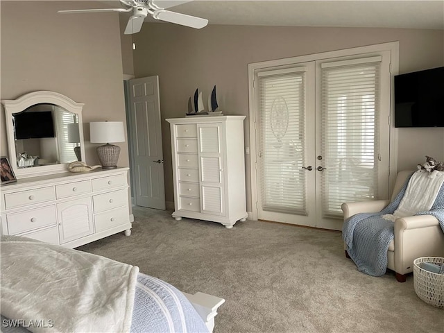 sitting room featuring vaulted ceiling, light colored carpet, french doors, and ceiling fan