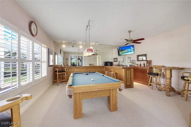 playroom with bar, light carpet, pool table, and ceiling fan