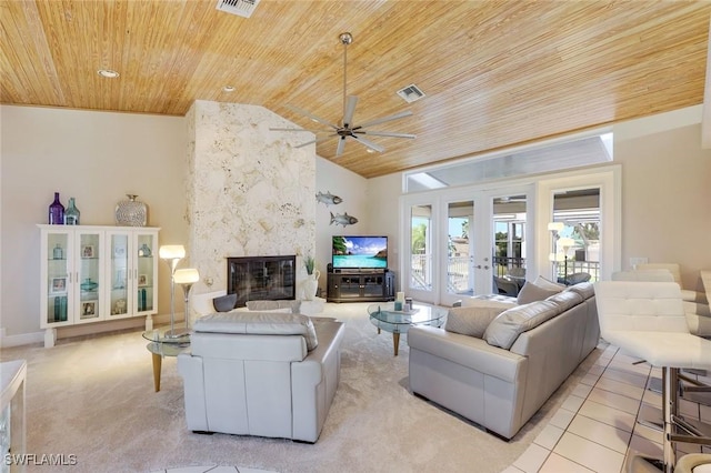 living room with ceiling fan, high vaulted ceiling, a fireplace, wooden ceiling, and french doors