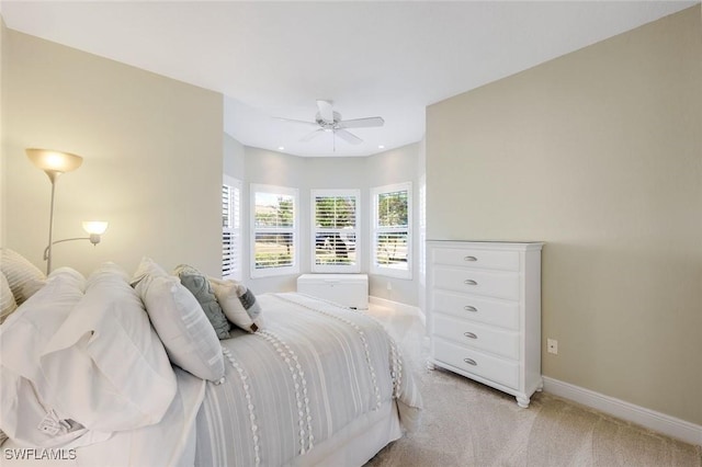 bedroom featuring light carpet and ceiling fan