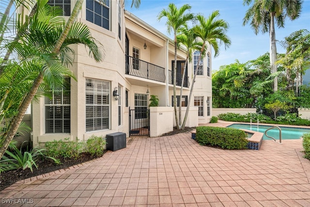 view of patio / terrace featuring a fenced in pool