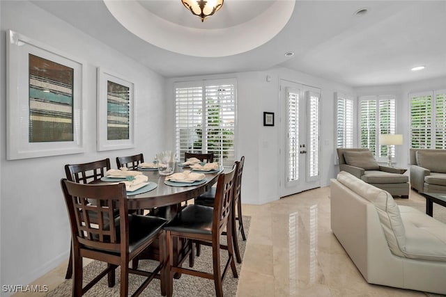 dining room featuring a tray ceiling