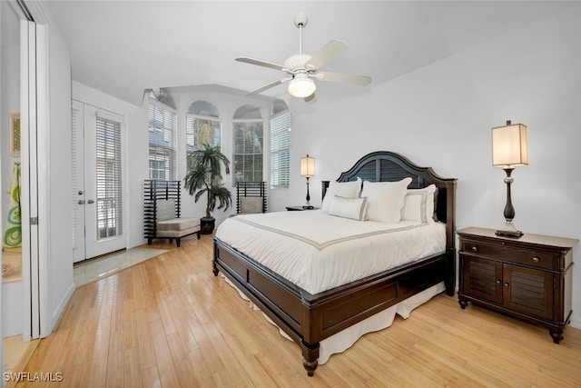 bedroom with ceiling fan, light hardwood / wood-style floors, and access to exterior