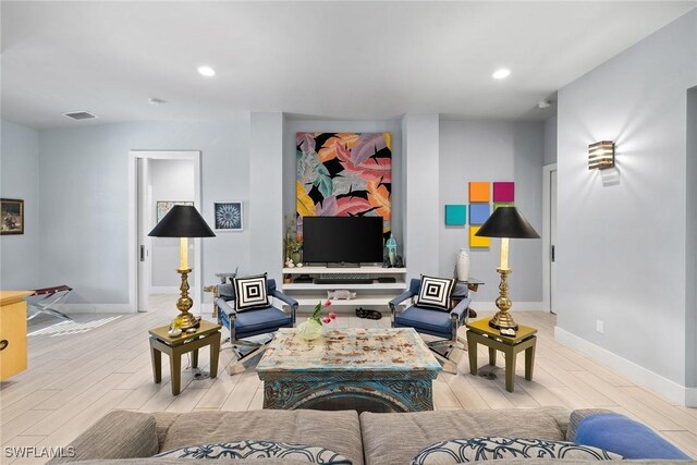 living room with light hardwood / wood-style floors