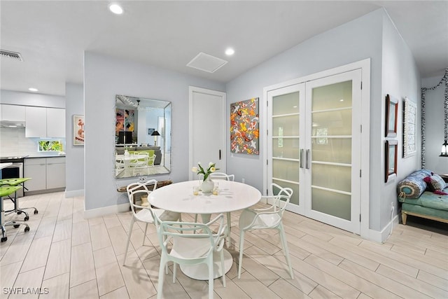 dining space featuring french doors