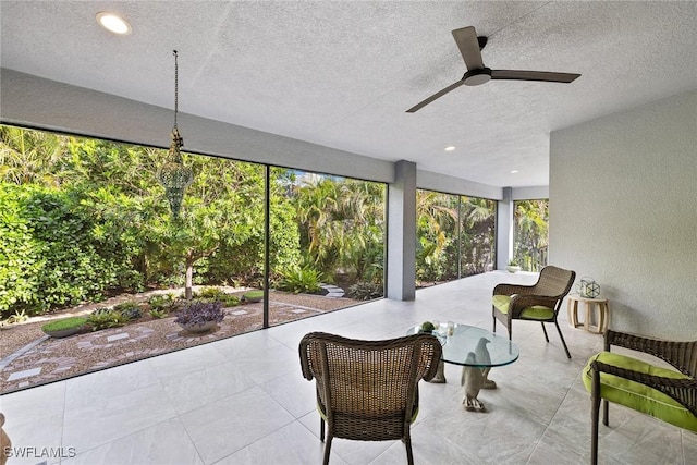 sunroom / solarium with ceiling fan