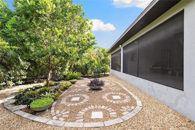 view of yard featuring a sunroom