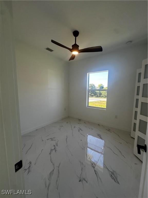 unfurnished room featuring ceiling fan