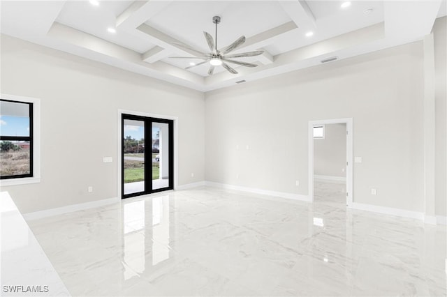 spare room with a high ceiling and ceiling fan