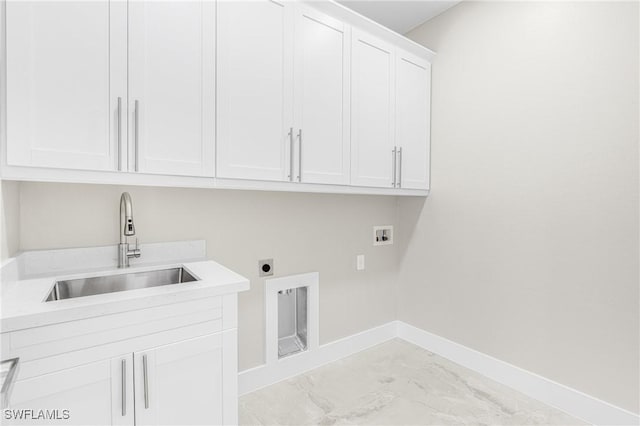 laundry room featuring hookup for an electric dryer, cabinets, sink, and hookup for a washing machine