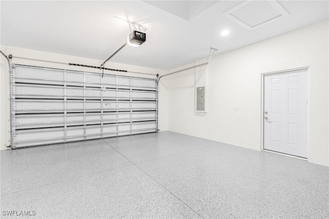 garage featuring electric panel and a garage door opener