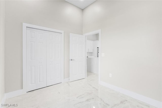 unfurnished bedroom featuring a closet