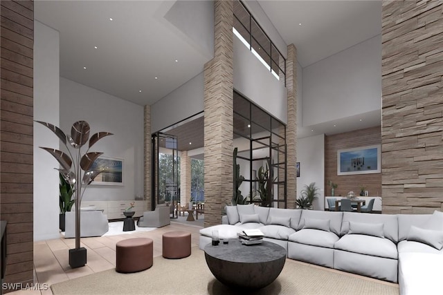 tiled living room featuring a high ceiling and ornate columns