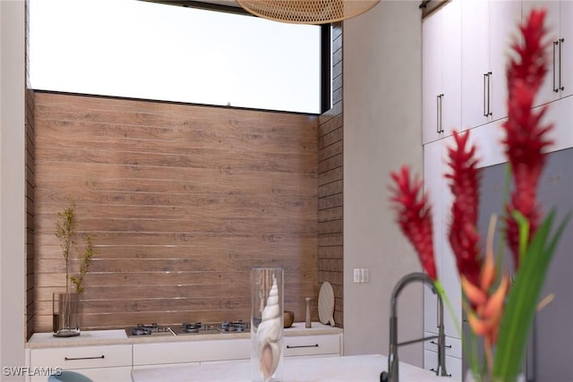 interior space featuring plenty of natural light and wooden walls