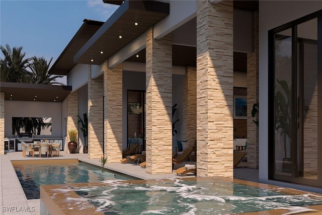 view of pool with a jacuzzi and a patio area