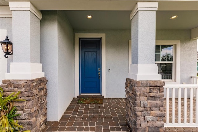 entrance to property with covered porch