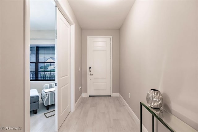 doorway to outside with light hardwood / wood-style flooring