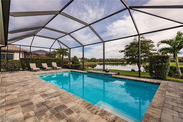 view of pool featuring a lanai, a patio area, and a water view