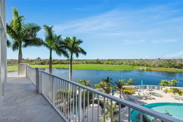 balcony with a water view and a patio