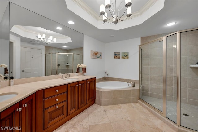 bathroom featuring a tray ceiling, crown molding, and a notable chandelier