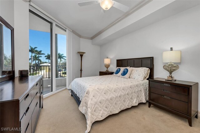 bedroom featuring ceiling fan, access to exterior, ornamental molding, and light carpet