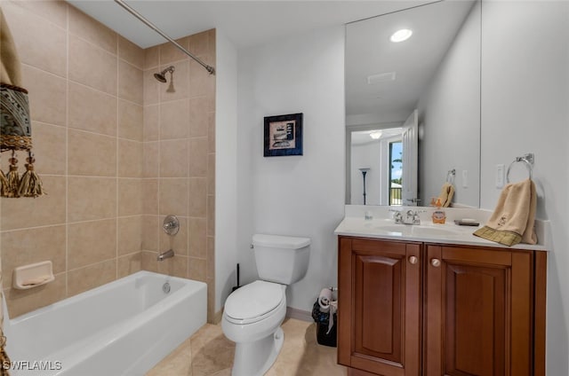 full bathroom featuring tile patterned floors, vanity, toilet, and tiled shower / bath