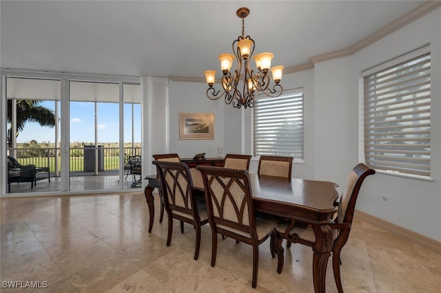 dining space featuring crown molding and an inviting chandelier