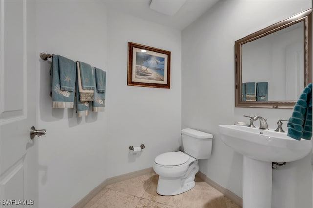 bathroom with tile patterned floors and toilet