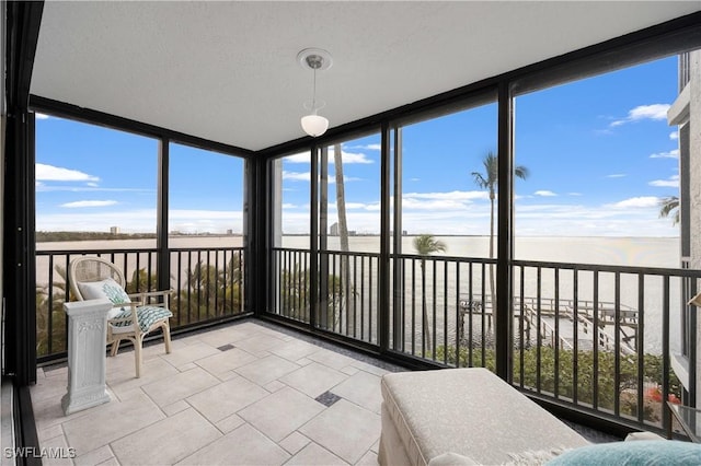 unfurnished sunroom featuring a healthy amount of sunlight