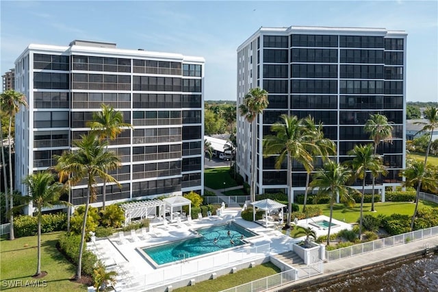 view of building exterior with a community pool