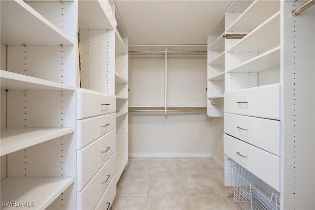 walk in closet featuring light tile patterned floors