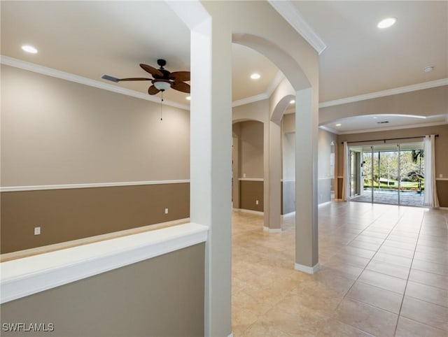 corridor with light tile patterned floors and crown molding