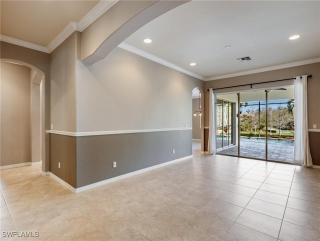 empty room featuring crown molding