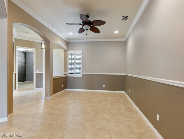 unfurnished room featuring ceiling fan, light tile patterned floors, and crown molding