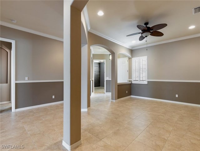 empty room with ceiling fan and crown molding